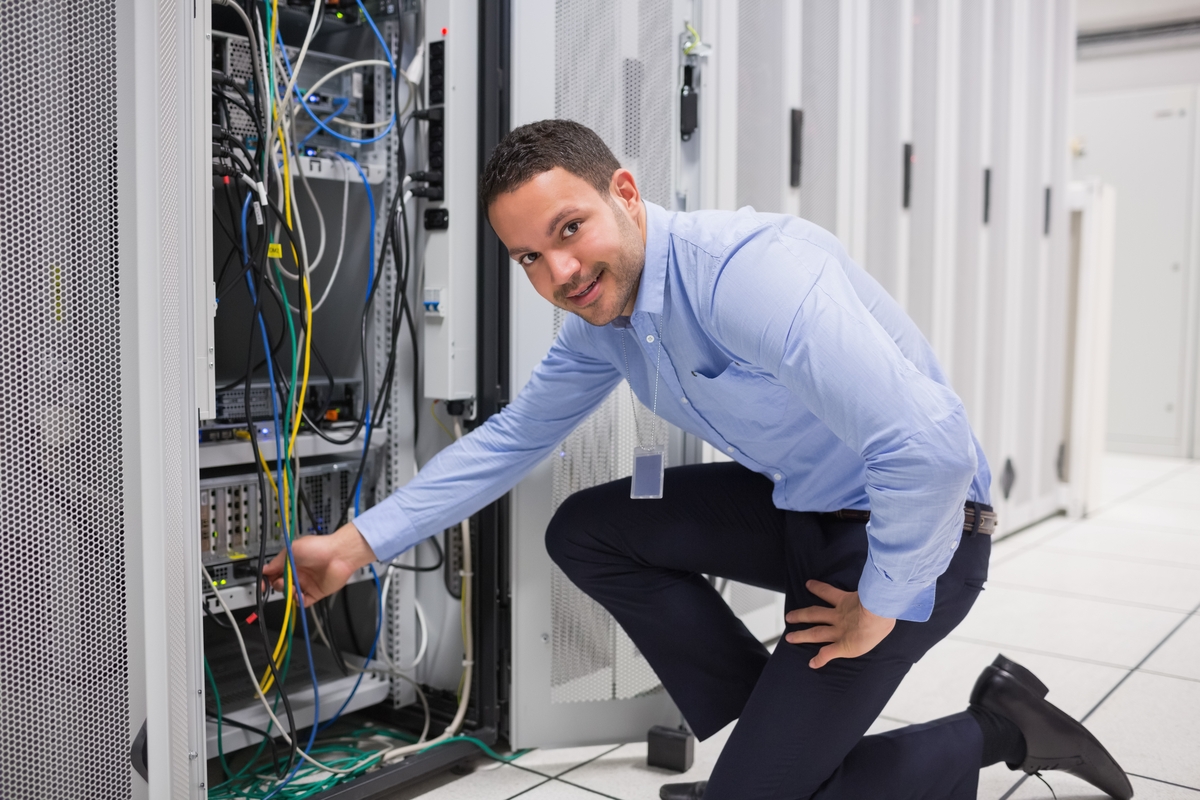 IT technician fixing network issue at office building in Montclair, NJ